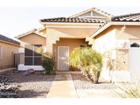 Charming single-story home with desert landscaping, a tiled roof, and a welcoming front entrance at 2509 E Paraiso Dr, Phoenix, AZ 85024