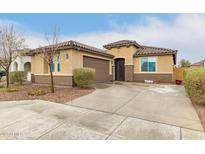 Charming single-story home with a well-maintained yard and inviting curb appeal at 25955 W Deer Valley Rd, Buckeye, AZ 85396