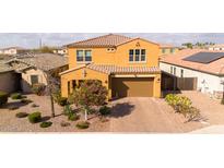 Inviting two-story home with a well-manicured front yard and a spacious two-car garage at 3322 E Lantana Pl, Chandler, AZ 85286