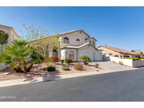 Charming two-story home with a three-car garage and beautiful desert landscaping in a quiet neighborhood at 1331 E Voltaire Ave, Phoenix, AZ 85022