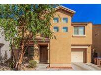 Charming two-story home featuring desert landscaping, a covered porch, and a convenient attached garage at 335 S Travis --, Mesa, AZ 85208