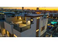 Stunning aerial view showcasing the rooftop patio with a dining area and city views at 377 E Windsor Ave # 4, Phoenix, AZ 85004