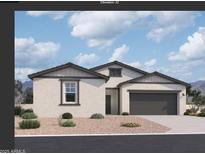 Inviting single-story home featuring a neutral color scheme, two-car garage, and manicured landscaping at 47251 W Mellen Ln, Maricopa, AZ 85139