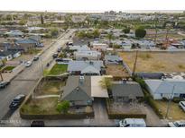 This aerial view shows a charming neighborhood with mature landscaping and well-maintained homes at 660 E 1St Ave, Mesa, AZ 85204