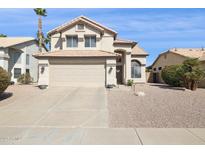 Charming two-story home with a tile roof, desert landscaping and a spacious two car garage at 9264 E Hillery Way, Scottsdale, AZ 85260
