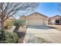 Charming single-story home featuring a two-car garage and desert landscaping at 11229 E Emelita Ave, Mesa, AZ 85208