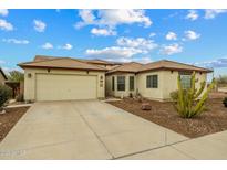 Charming home with a well-manicured yard and a spacious two-car garage, offering both convenience and curb appeal at 25320 W Heathermoor Dr, Buckeye, AZ 85326