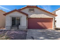 Charming single-story home featuring a terra cotta tiled roof and a spacious two car garage at 38226 N Kyle St, San Tan Valley, AZ 85140