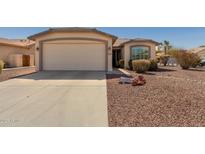 Charming single-story home featuring a two-car garage and low maintenance desert landscaping at 3921 E Runaway Bay Pl, Chandler, AZ 85249