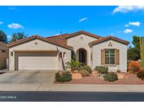 Charming single-story home featuring a neutral color, tile roof, and a well-maintained landscaped front yard at 4138 E Indigo St, Gilbert, AZ 85298