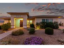 Inviting single-story home featuring a landscaped front yard with a decorative stone pathway, enhancing curb appeal at 23145 E Stonecrest Dr, Queen Creek, AZ 85142