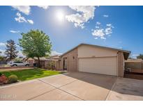 Charming single-Gathering home featuring a manicured lawn and two-car garage in a quiet neighborhood at 2317 E Concorda Dr, Tempe, AZ 85282