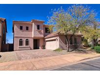 Two-story home with a well-maintained front yard and neutral color palette at 35210 N 34Th Ln, Phoenix, AZ 85086