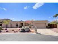 Charming single-story home with a desert landscape and a well-maintained front yard at 536 W Surrey Ave, Phoenix, AZ 85029