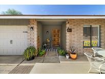 Charming single-story home featuring a brick facade and inviting front entrance at 6522 S Farmer Ave, Tempe, AZ 85283