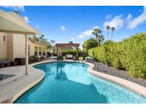 Sparkling pool with a beautiful pergola, lounge area and plenty of privacy at 7800 E Via Del Futuro E --, Scottsdale, AZ 85258