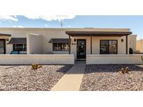 Charming townhome featuring a private entryway and desert landscaping at 849 E Lancaster Cir, Florence, AZ 85132
