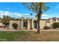 Charming single-story home featuring well-maintained landscaping and inviting curb appeal at 9036 N 51St Ln, Glendale, AZ 85302