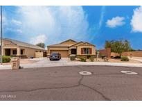 Charming single-story home with a desert-landscaped yard and a spacious driveway at 9302 W Georgia Ave, Glendale, AZ 85305
