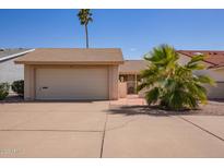 Charming single-story home featuring a two-car garage, low maintenance landscaping, and inviting curb appeal at 1632 Leisure World --, Mesa, AZ 85206