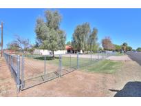 Charming single-story home with mature trees and a fenced front yard at 18622 E Via De Arboles --, Queen Creek, AZ 85142