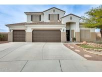 Stunning two-story home featuring a three-car garage and professionally landscaped front yard at 23693 W La Vista Cir, Buckeye, AZ 85396