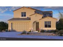 Charming two-story home with tile roof, arched entryway, two car garage, and desert landscaping at 8842 W Orange Dr, Glendale, AZ 85305