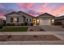 Charming single-story home with manicured lawn and a two-car garage at 20040 E Kestrel St, Queen Creek, AZ 85142