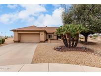 Charming single-story home featuring desert landscaping and a two-car garage at 20408 N Tanglewood Dr, Sun City West, AZ 85375