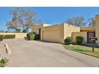 Charming single-story home with a stucco exterior, mature landscaping, and an attached two-car garage at 2102 W Marlette Ave, Phoenix, AZ 85015