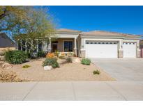 Charming single-story home featuring a three-car garage and low-maintenance desert landscaping at 12706 E Desert Cove Ave, Scottsdale, AZ 85259