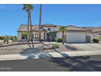 Charming single-story home with tile roof, desert landscaping, and a two-car garage at 15501 W Las Verdes Way, Surprise, AZ 85374