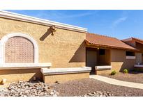 Charming single-story home features a red tile roof and decorative window detail at 20421 N 3Rd Dr # 2, Phoenix, AZ 85027