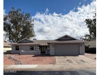 Charming single-story home featuring a two car garage and low maintenance landscaping at 2284 Leisure World --, Mesa, AZ 85206