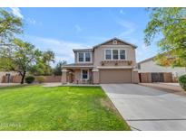 Charming two-story home with a well-manicured lawn and a spacious driveway, perfect for Gathering living at 2501 E Los Alamos St, Gilbert, AZ 85295