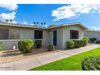 Charming single-story home with a tidy front yard, featuring lush green grass and trimmed shrubs at 3402 N 32Nd St # 116, Phoenix, AZ 85018