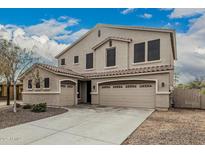 Beautiful two-story home featuring a three-car garage and tiled roof at 4170 N 154Th Dr, Goodyear, AZ 85395