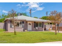 Charming single-story home with a well-manicured front yard and beautiful, drought-resistant landscaping at 4512 E Turney Ave, Phoenix, AZ 85018