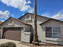 Charming single-Gathering home with a two-car garage and a stucco exterior at 8762 W Grovers Ave, Peoria, AZ 85382