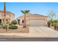 Charming single-story home featuring desert landscaping and a spacious two-car garage at 11765 W Maui Ln, El Mirage, AZ 85335