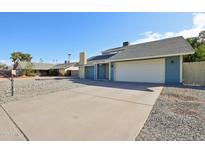 Charming single-Gathering home featuring a spacious driveway and a two-car garage at 14209 N 45Th Ave, Glendale, AZ 85306