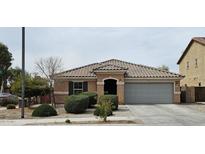 Inviting single-story home featuring a neutral color palette, well-maintained landscaping, and a two-car garage at 2678 S 172Nd Dr, Goodyear, AZ 85338