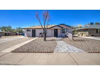 Inviting single-level home with a stone walkway and xeriscaped front yard for easy upkeep at 350 S Thunderbird Dr, Apache Junction, AZ 85120