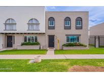 Charming townhouse featuring a well-manicured lawn and unique architectural details at 3823 N 28Th St, Phoenix, AZ 85016