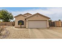 Charming single-story home with a two-car garage and low-maintenance desert landscaping at 9948 N 94Th Ave, Peoria, AZ 85345