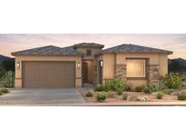 Attractive single-story home with desert landscaping and a two-car garage at 16722 W Saguaro Park Ln, Surprise, AZ 85387