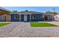 Charming single-story home featuring a gravel yard, new grass, and a covered carport at 171 W Tulsa St, Chandler, AZ 85225