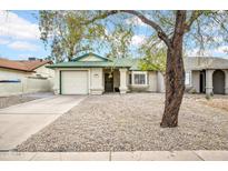 Charming single-story home featuring a well-maintained yard and attached one car garage at 1717 E Sandra Ter, Phoenix, AZ 85022