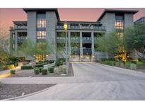 Contemporary building boasting manicured landscaping, modern architecture, and convenient garage access at 18720 N 101St St # 3021, Scottsdale, AZ 85255