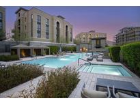 Beautiful swimming pool and spa surrounded by manicured landscaping and inviting lounge areas at 18720 N 101St St # 3021, Scottsdale, AZ 85255